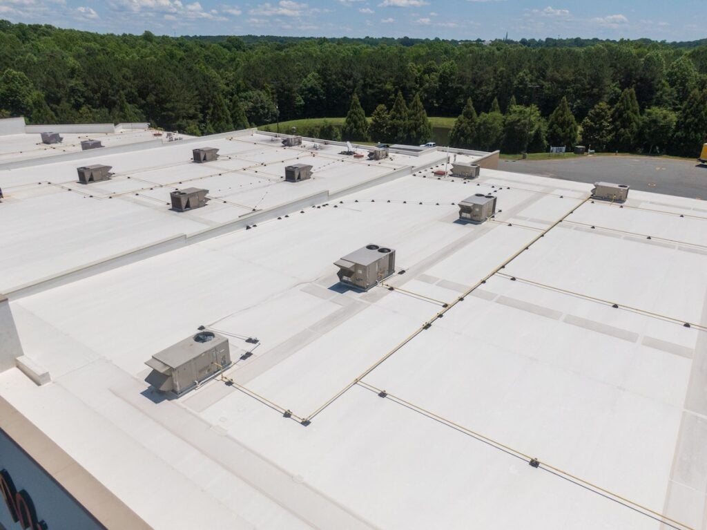 Drone Images of Commercial Roofs Featuring TPO and Asphalt Shingles: Midday, Sunny, No People